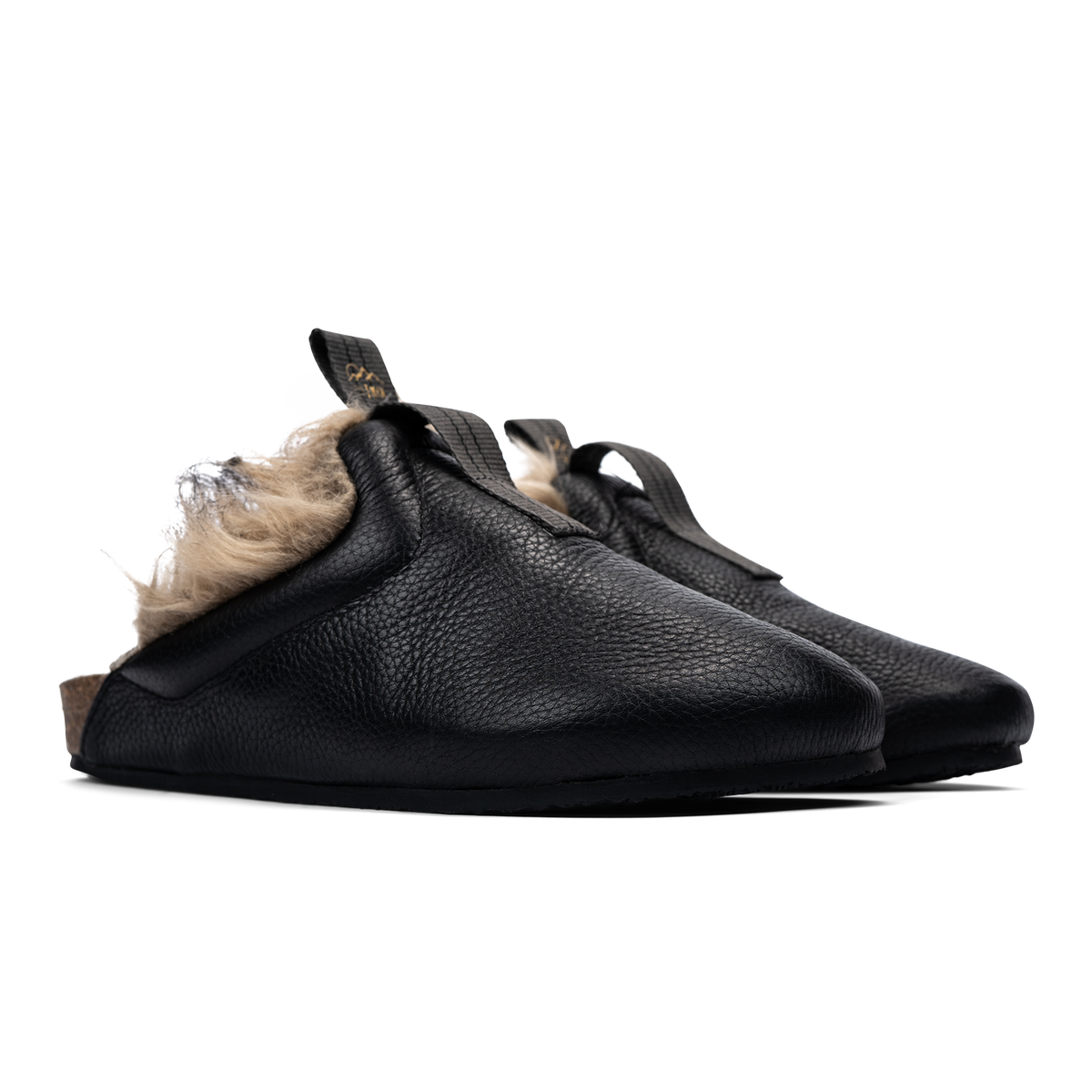 3/4 view  Bantha Himalya is a Mule with faux fur lining. - Black tumbled leather upper and vibram sheet rubber bottom.